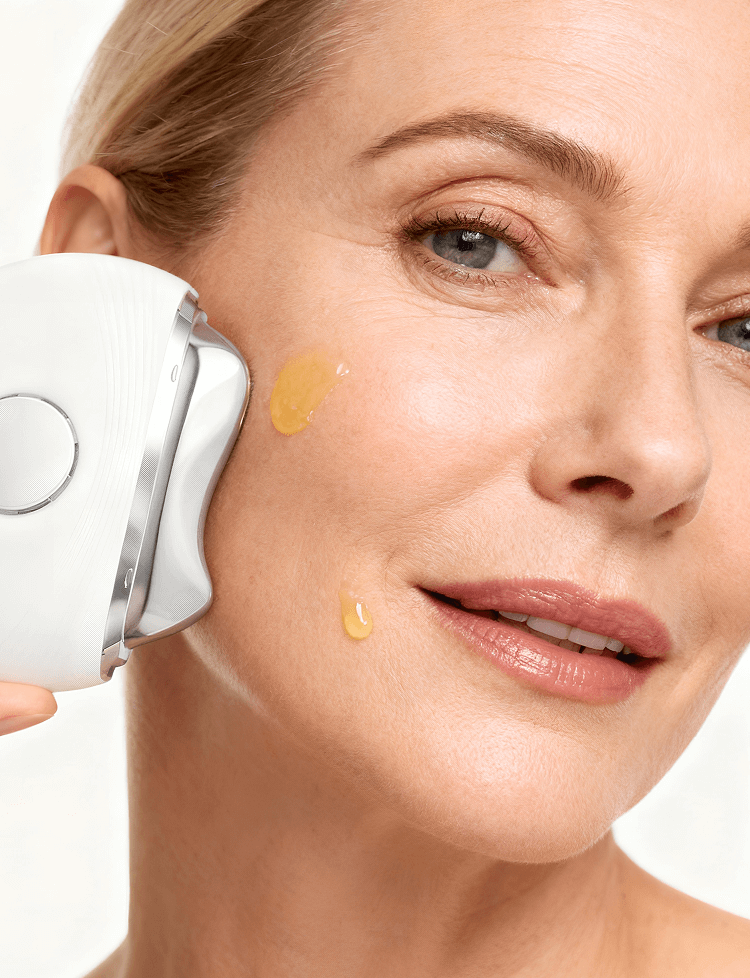 Pureance thermal beauty device gliding over face with serum applied