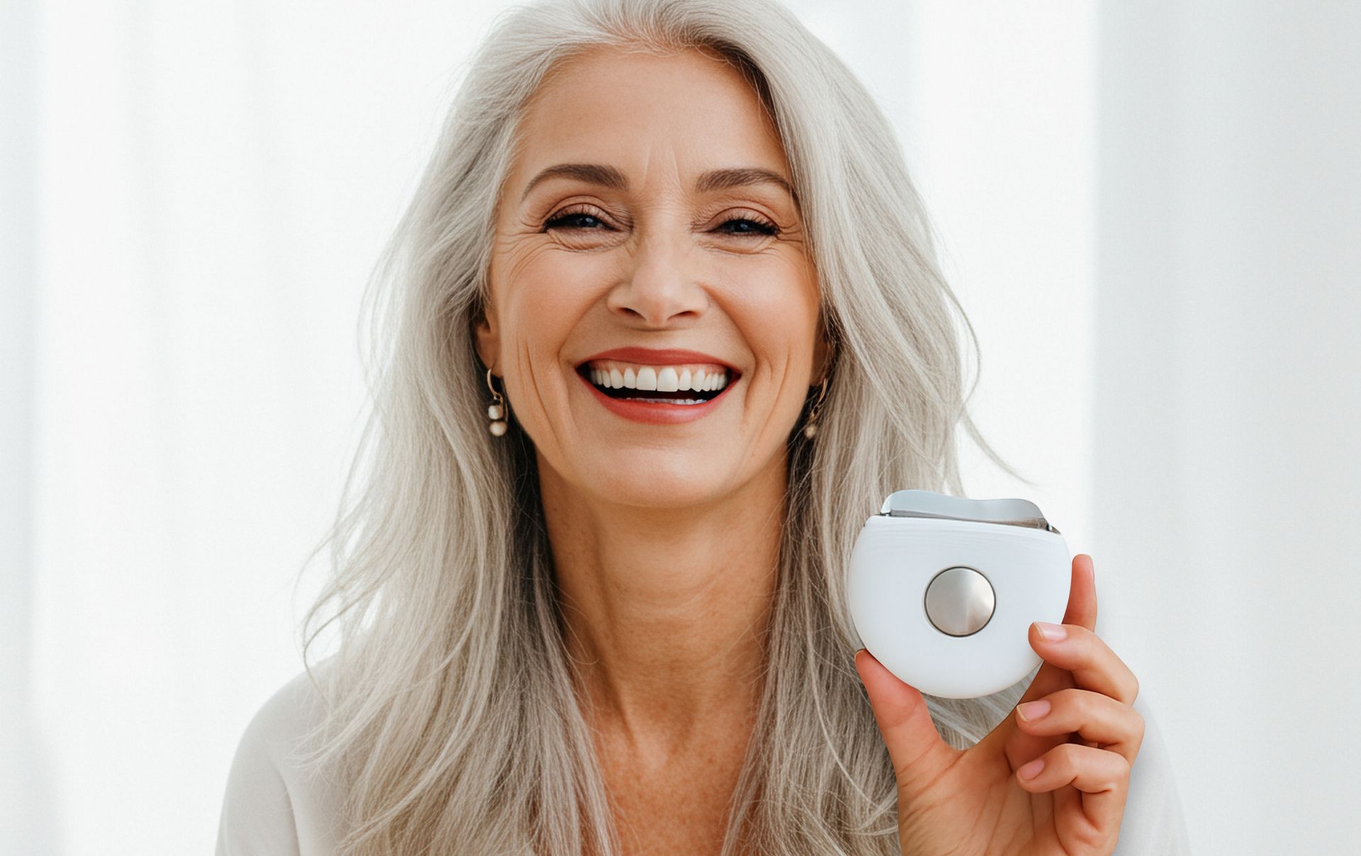 Smiling woman holding a Hot & Cold Beauty Device
